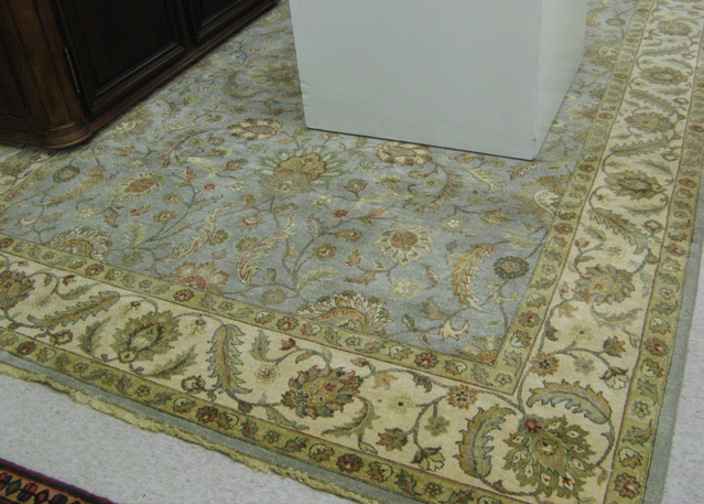 Appraisal: HAND KNOTTED ORIENTAL CARPET Pakistani-Persian overall floral design on powder