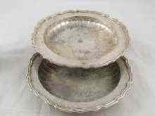 Appraisal: Two silver matching graded dessert dishes with chased decoration to