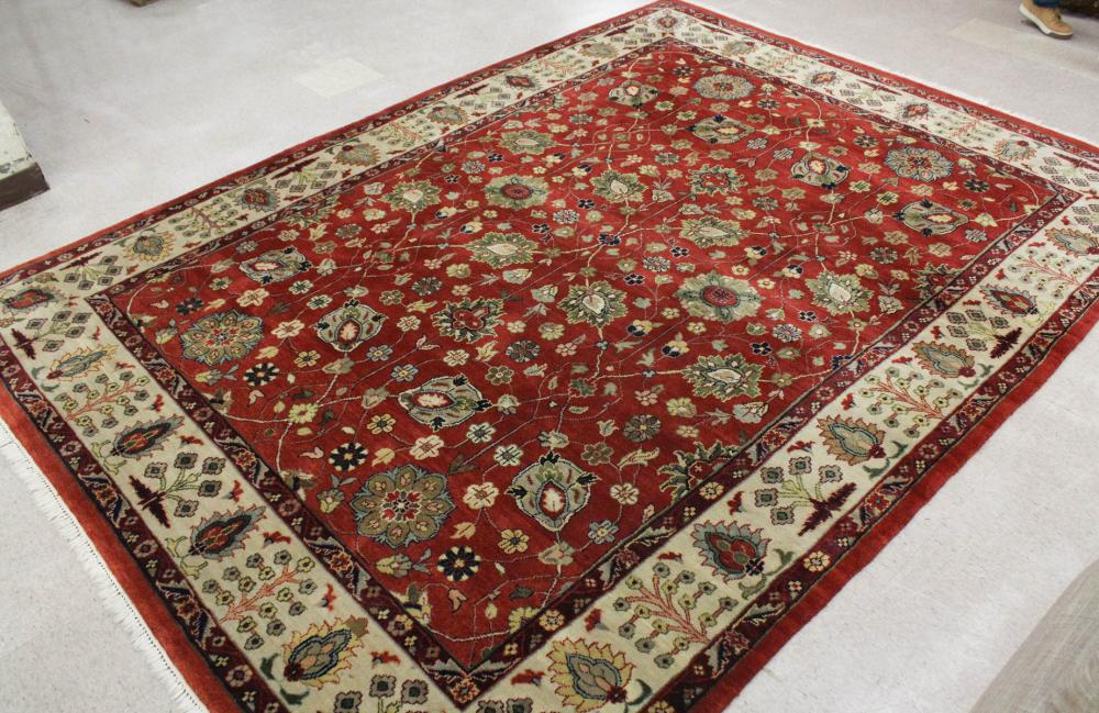 Appraisal: HAND KNOTTED ORIENTAL CARPET Indo-Persian overall floral design on red