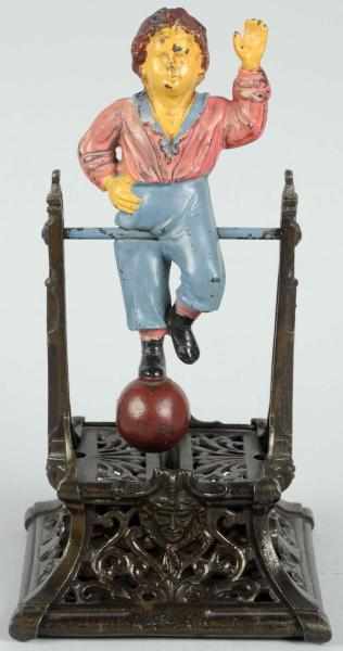 Appraisal: Cast Iron Boy on Trapeze Mechanical Bank Blue pant variation