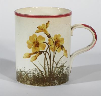 Appraisal: A Wemyss Pottery mug painted with primrose in yellow and