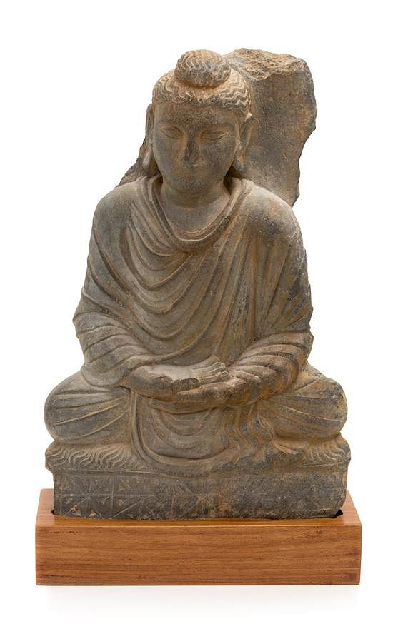 Appraisal: A Gandharan Gray Schist Figure of Seated Buddha Height inches