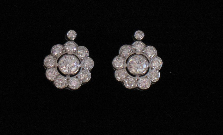 Appraisal: A PAIR OF DIAMOND EAR STUDS each stud with a