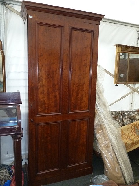 Appraisal: A VICTORIAN MAHOGANY CUPBOARD with single twin panelled door standing