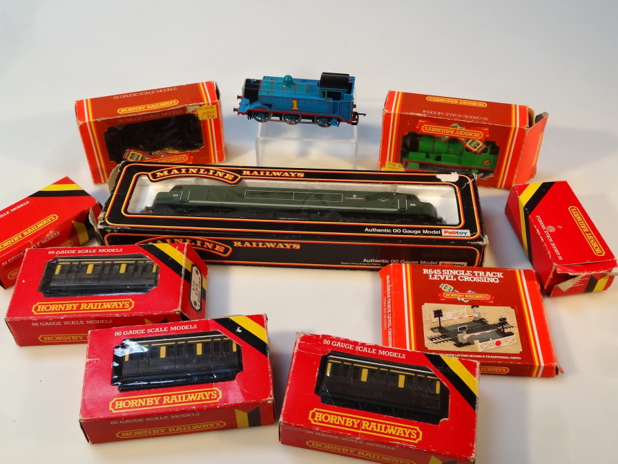 Appraisal: Various OO-Gauge trains and accessories to include a Palitoy Manchester