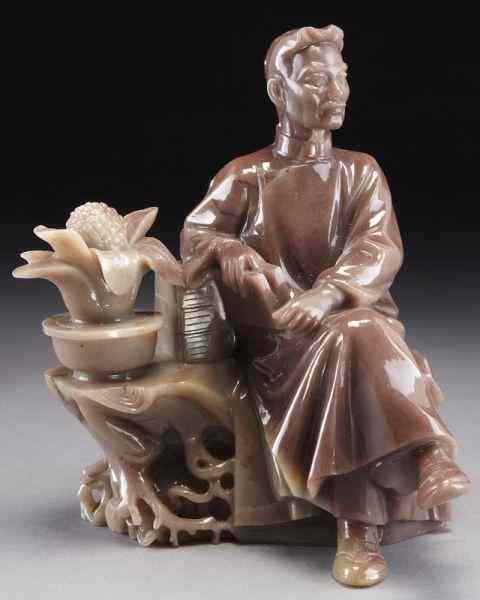 Appraisal: Chinese Cultural Revolution carved hard stonefigure depicting Lu Xun seated