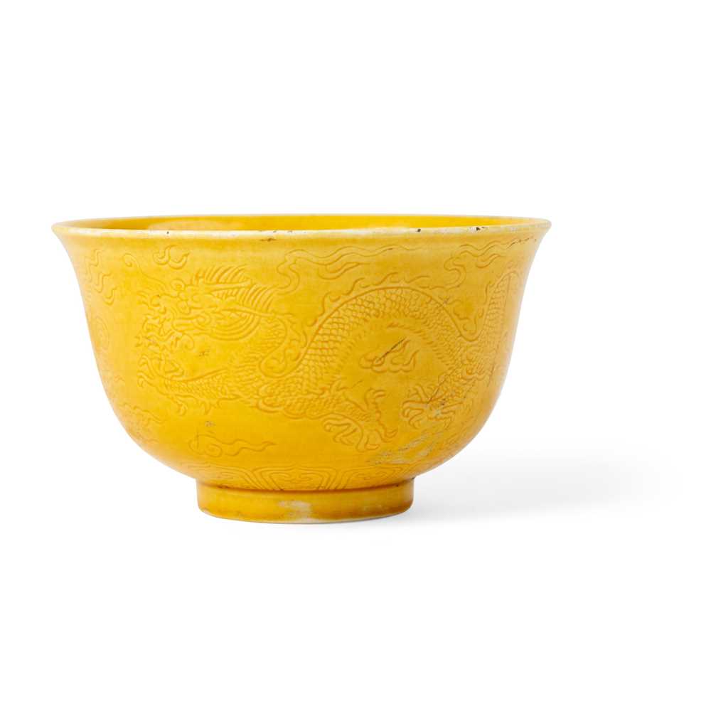 Appraisal: YELLOW-GLAZED 'DRAGON' CUP KANGXI MARK BUT LATER the exterior incised