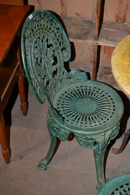 Appraisal: A PAIR OF VICTORIAN STYLE CAST IRON CHAIRS IN GREEN