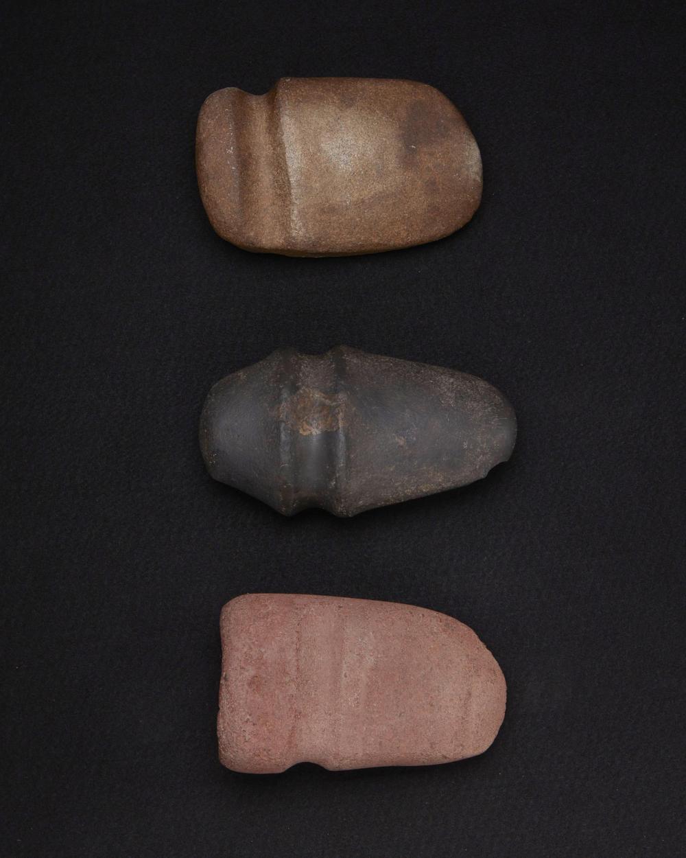 Appraisal: A group of large carved stone axes Pre-historic or later