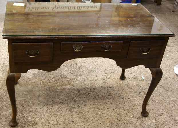 Appraisal: A Reproduction Queen Anne Walnut Writing table with Glass Top