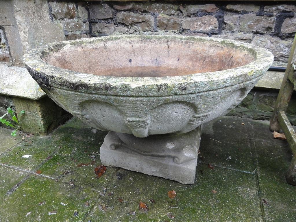 Appraisal: A large composition stone garden urn the shallow circular bowl