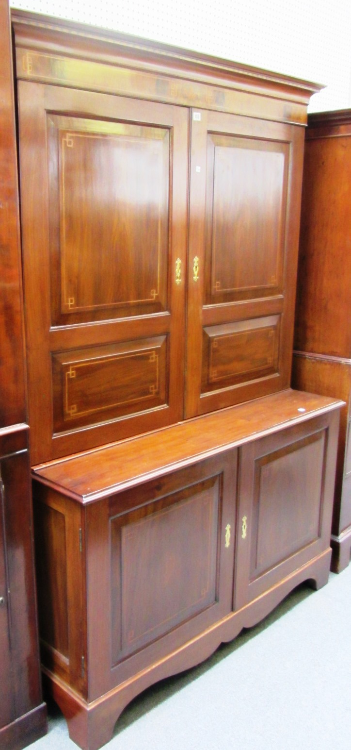 Appraisal: A continental walnut inlaid side cabinet with a pair of