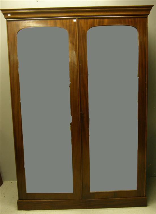 Appraisal: th century mahogany double wardrobe with two mirrored doors interior