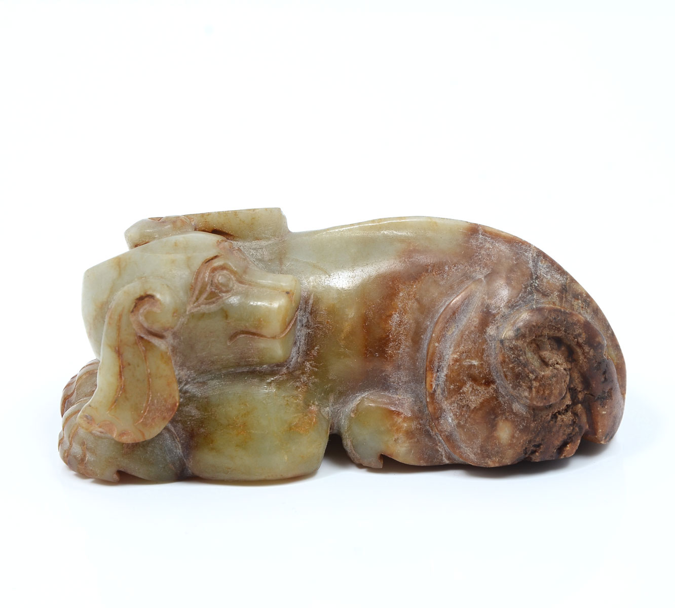 Appraisal: CARVED CHINESE RECUMBENT JADE DOG Carved Chinese archaic style recumbent