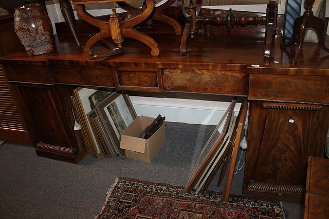 Appraisal: A LARGE EARLY VICTORIAN MAHOGANY BREAKFRONT SIDEBOARD with raised back