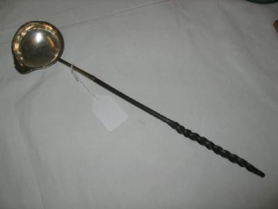 Appraisal: A GEORGIAN TODDY LADLE the circular bowl with geometrically moulded