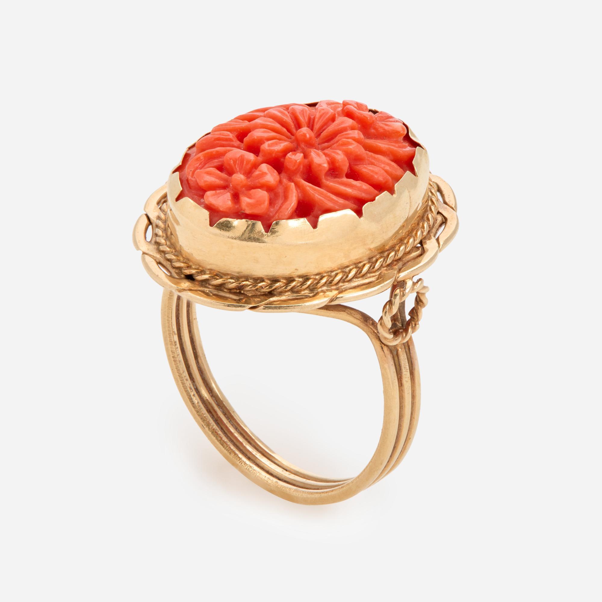 Appraisal: CARVED CORAL FLOWER RING IN K A k yellow gold