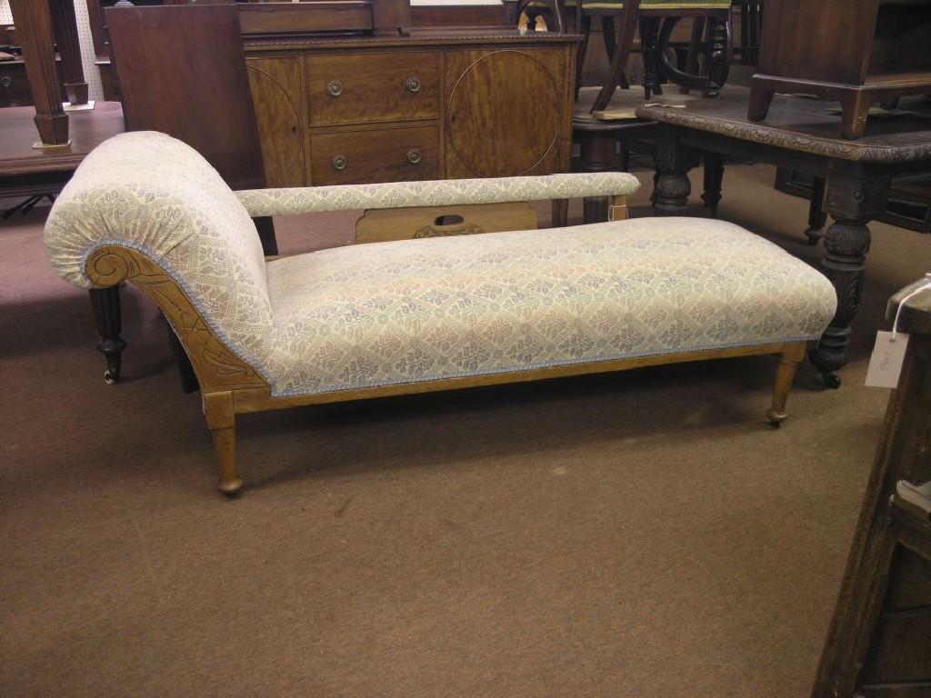 Appraisal: A late Victorian oak-framed chaise longue upholstered in a stamped