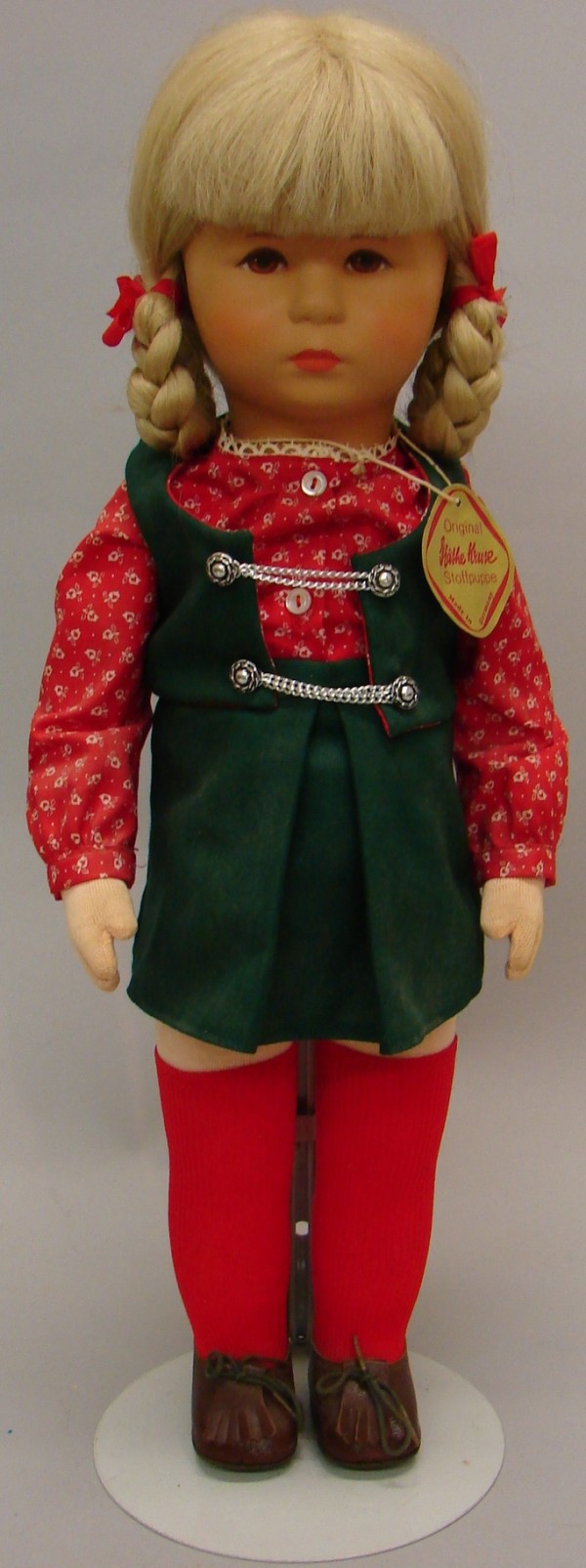 Appraisal: - Tagged Stofpuppe doll with hard plastic celluloid head and