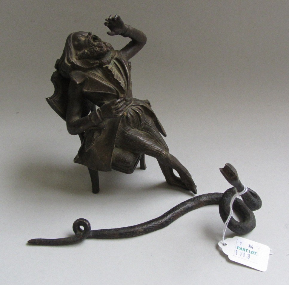 Appraisal: A bronze table lighter formed as a seated man cm