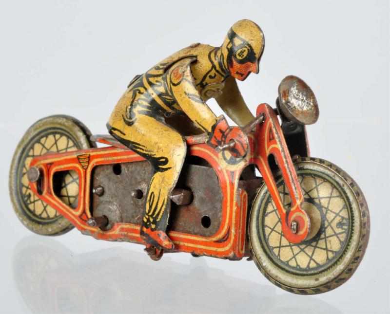 Appraisal: Tin Litho Motorcycle with Rider Wind-Up Penny Toy German Original