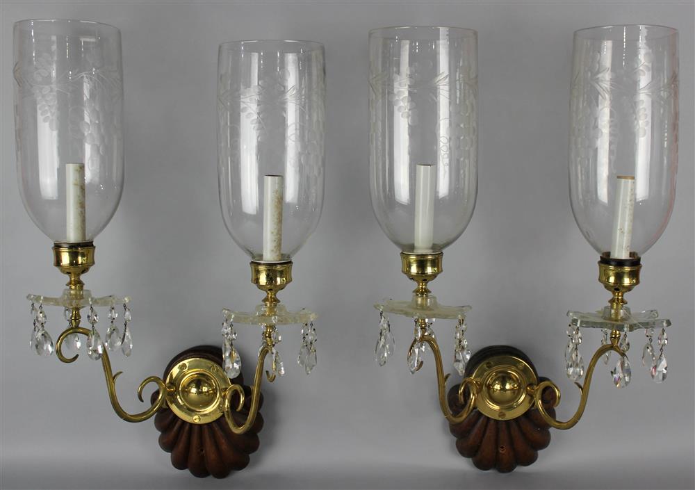 Appraisal: PAIR OF GEORGIAN STYLE CARVED WOOD AND BRASS TWO-LIGHT WALL