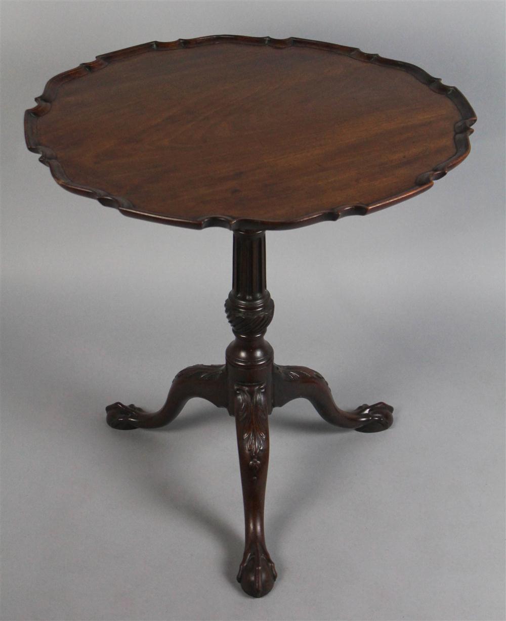 Appraisal: GEORGIAN CARVED MAHOGANY PIE CRUST TEA TABLE having a round