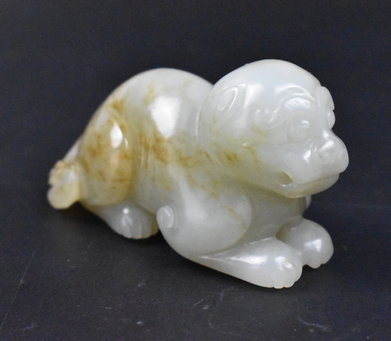 Appraisal: A Chinese jade carved lion figure dating from the Qing