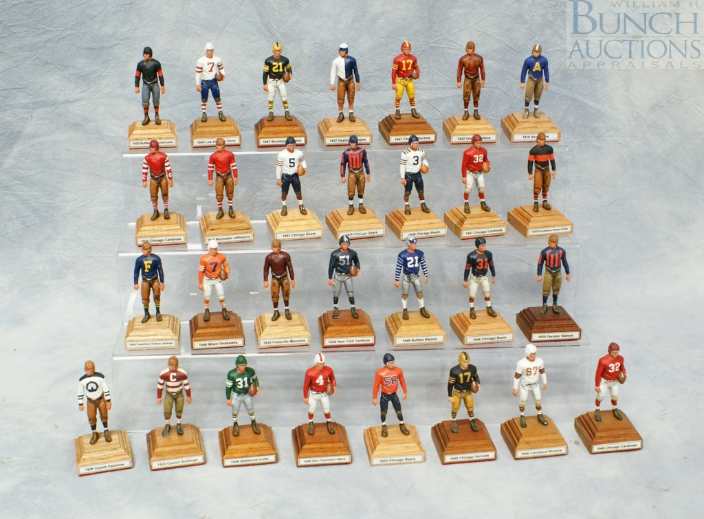 Appraisal: Football figures painted metal on wooden bases representative football players