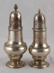 Appraisal: Two similar Georgian silver peppers one Robert Peaston London one