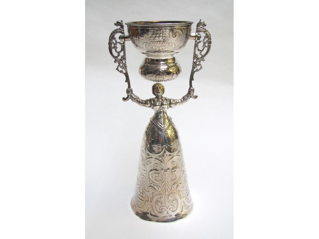 Appraisal: A Continental white metal wager cup of female form engraved