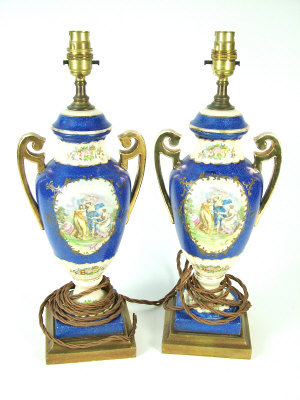 Appraisal: A pair of th century style Continental twin handled pedestal