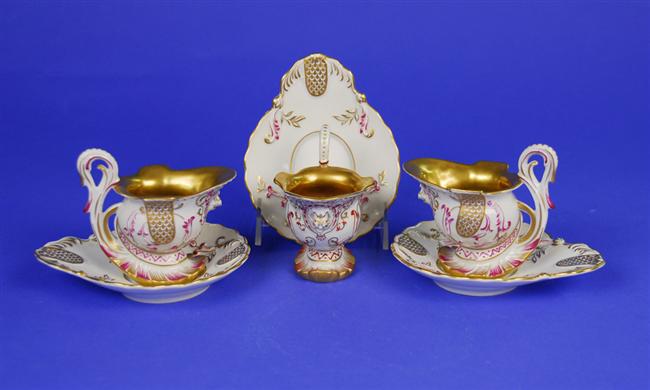 Appraisal: SET OF THREE CONTINENTAL PORCELAIN GILT DECORATED CUPS AND SAUCERS