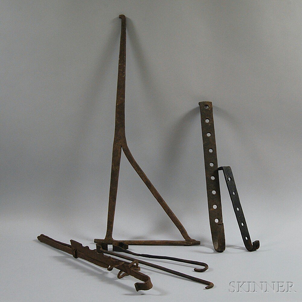 Appraisal: Six Wrought Iron Hearth Items four hooks a trammel and