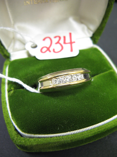 Appraisal: MAN'S DIAMOND AND FOURTEEN KARAT WHITE AND YELLOW GOLD RING