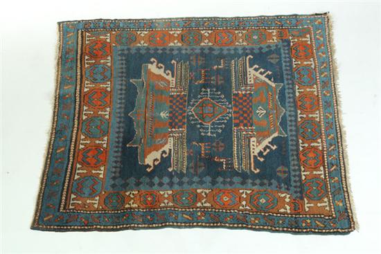 Appraisal: ORIENTAL RUG Caucasian Rust border and blue ground with figural