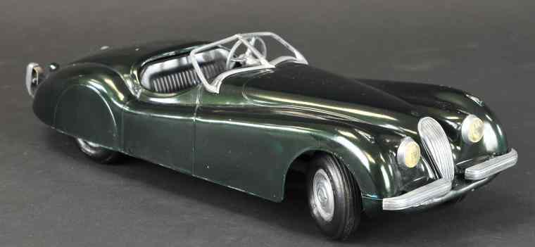 Appraisal: DOEPKE JAGUAR Die-cast metal with rubber tires and plastic interior