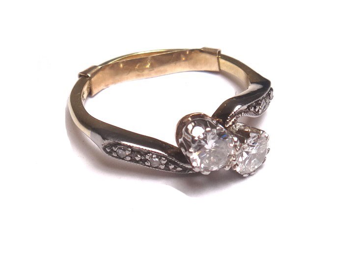 Appraisal: A gold and diamond set two stone ring claw set