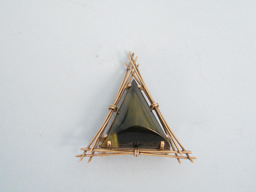 Appraisal: A contemporary Hawks-eye Pendant Brooch set in openwork triangular frame