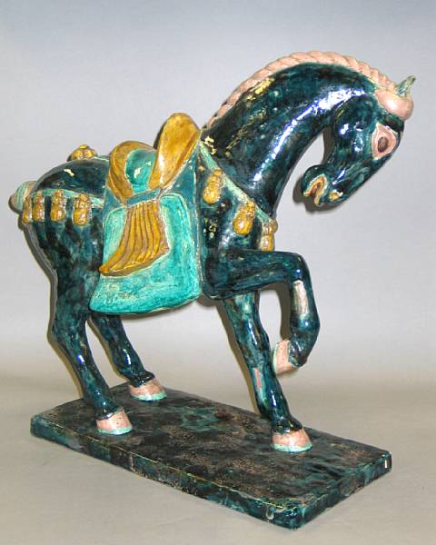 Appraisal: A Chinese style glazed pottery horse Molded in the manner