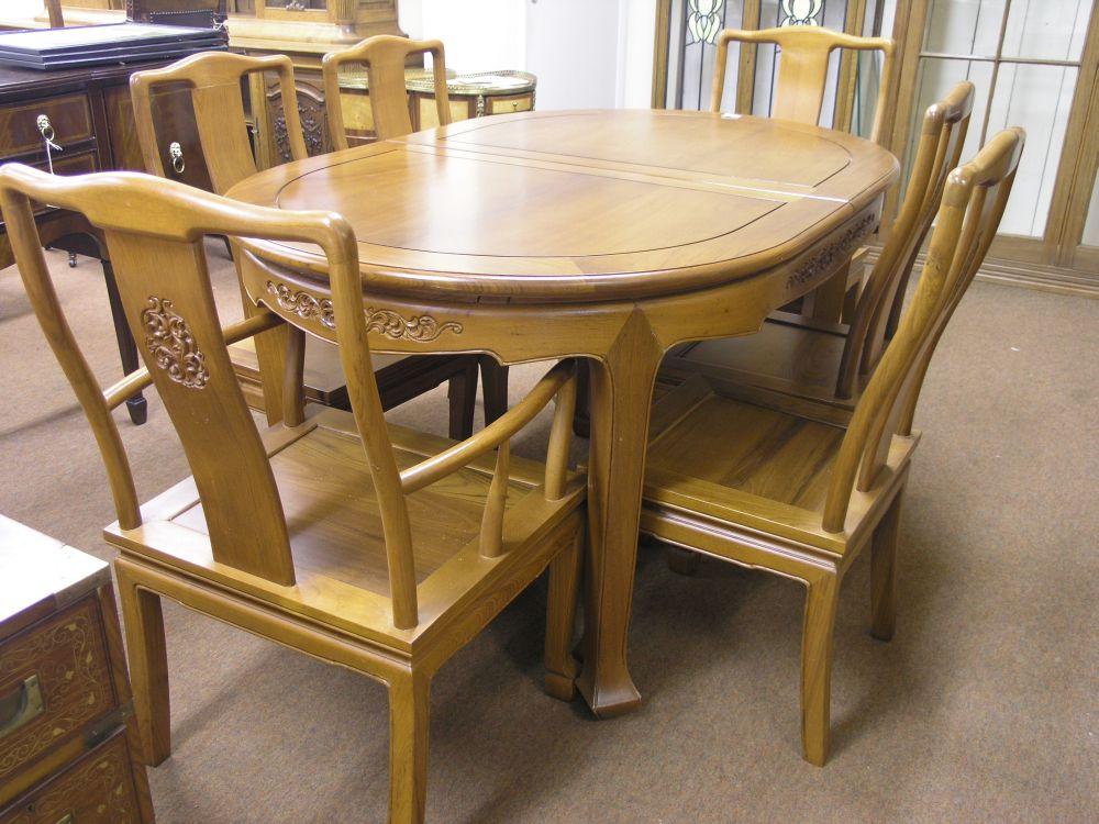 Appraisal: A far eastern hardwood dining suite consisting of oval extending