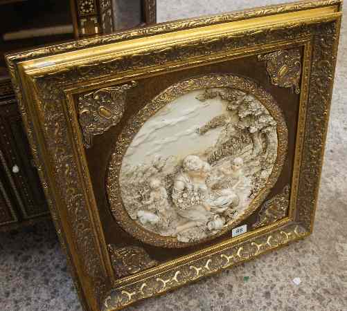 Appraisal: A framed and mounted Resin Embossed Carved Style Image Sculpture