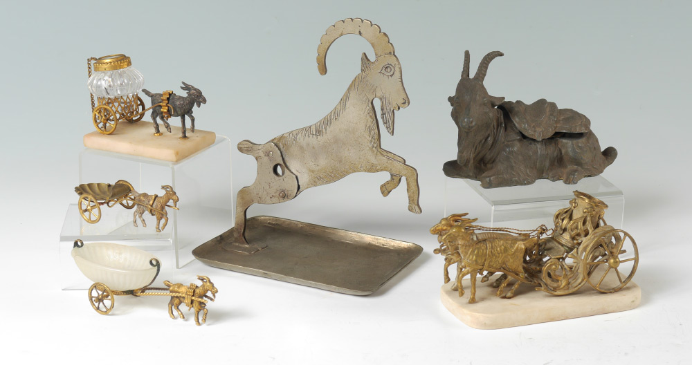 Appraisal: FIGURAL GOAT INKWELLS OPEN SALTS An assembled collection of pieces