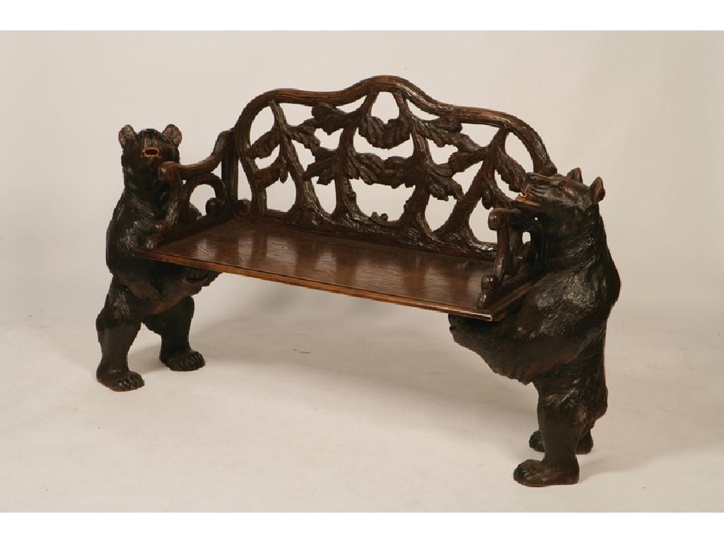 Appraisal: A BLACK FOREST STYLE BENCH the solid seat with rustic