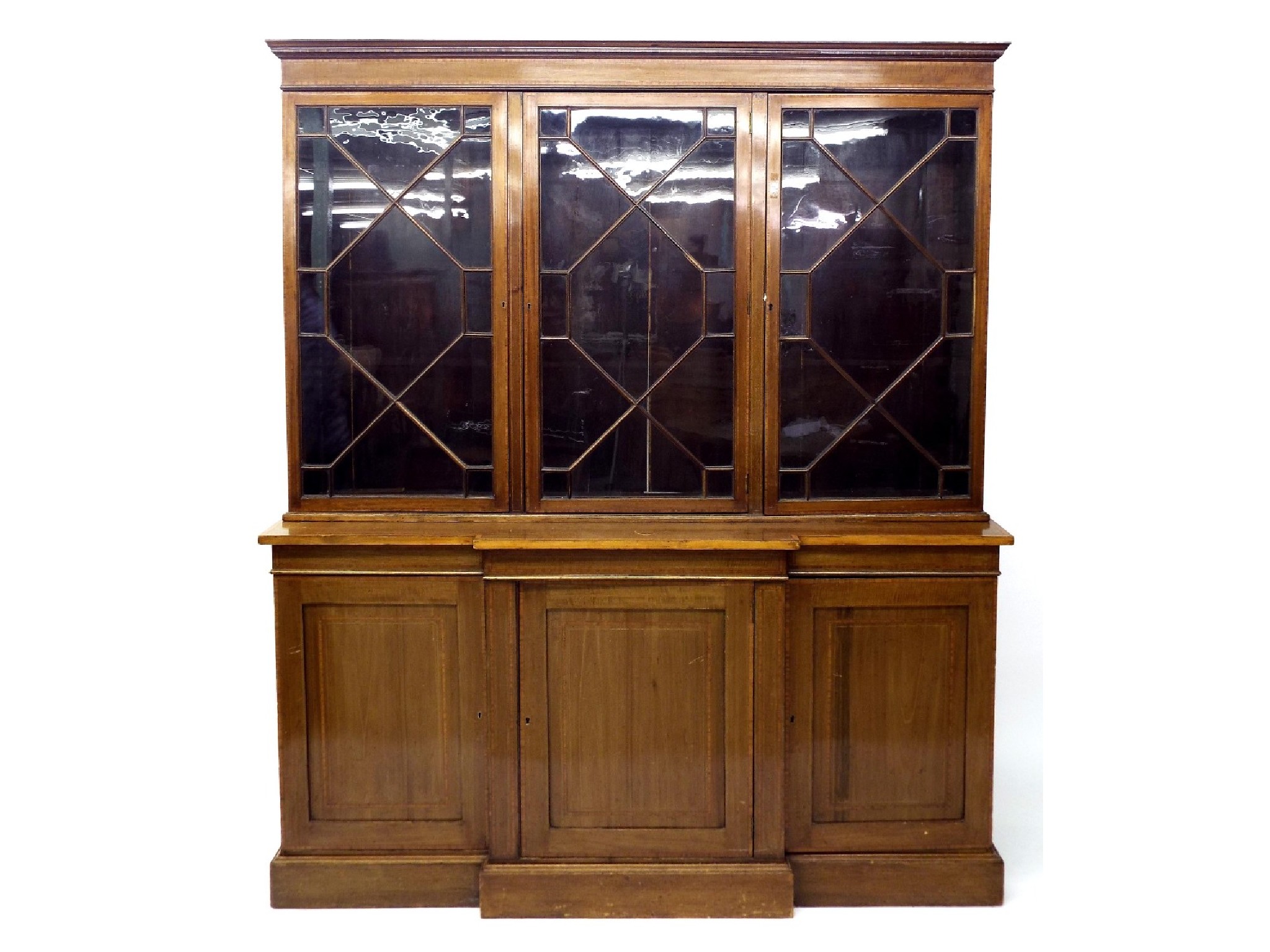 Appraisal: Edwardian mahogany and satinwood inlaid breakfront bookcase the glazed top