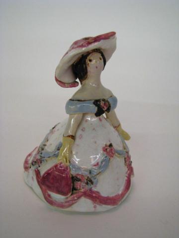 Appraisal: Overbeck Pottery Figure of a woman in a formal gown