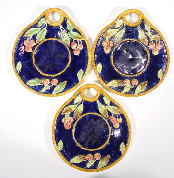 Appraisal: Three Majolica plates relief moulded with leaves and berries decorated