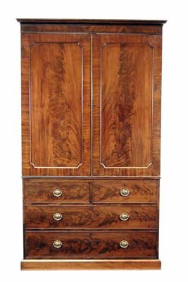 Appraisal: A mahogany linen press the detachable cornice above a pair