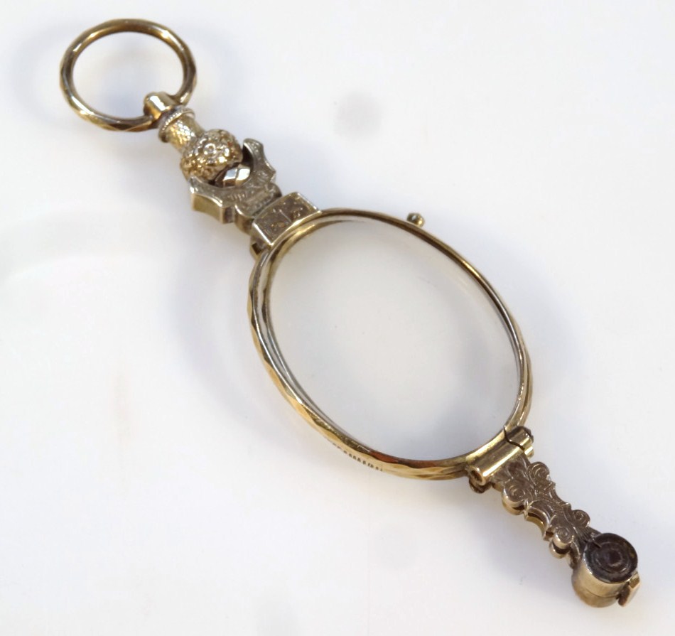 Appraisal: An early thC spring loaded pince-nez with shaped scroll centre