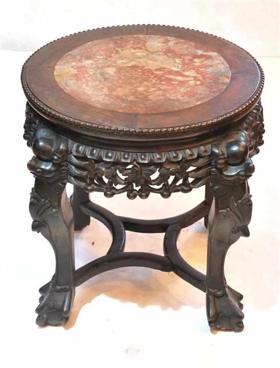 Appraisal: A Chinese rosewood and marble pedestal The circular marble inset